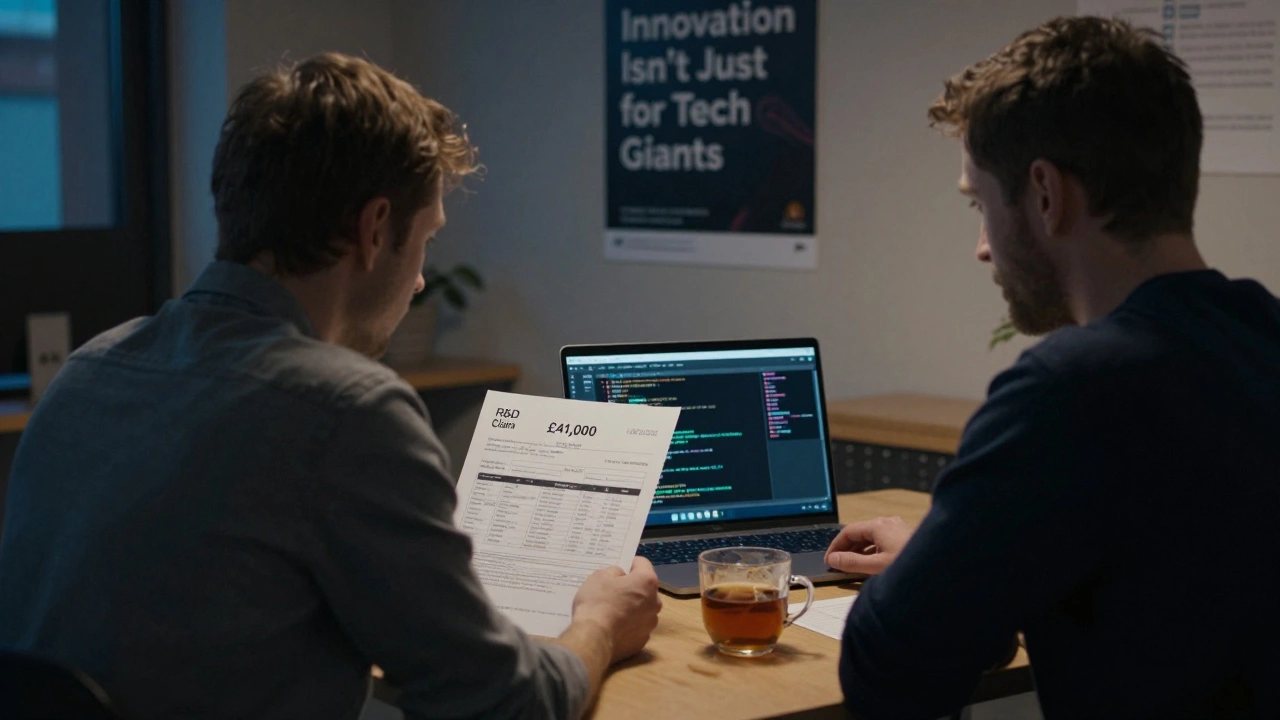 Startup founder staring at a bank deposit notification with R&amp;D claim documents on a laptop screen.